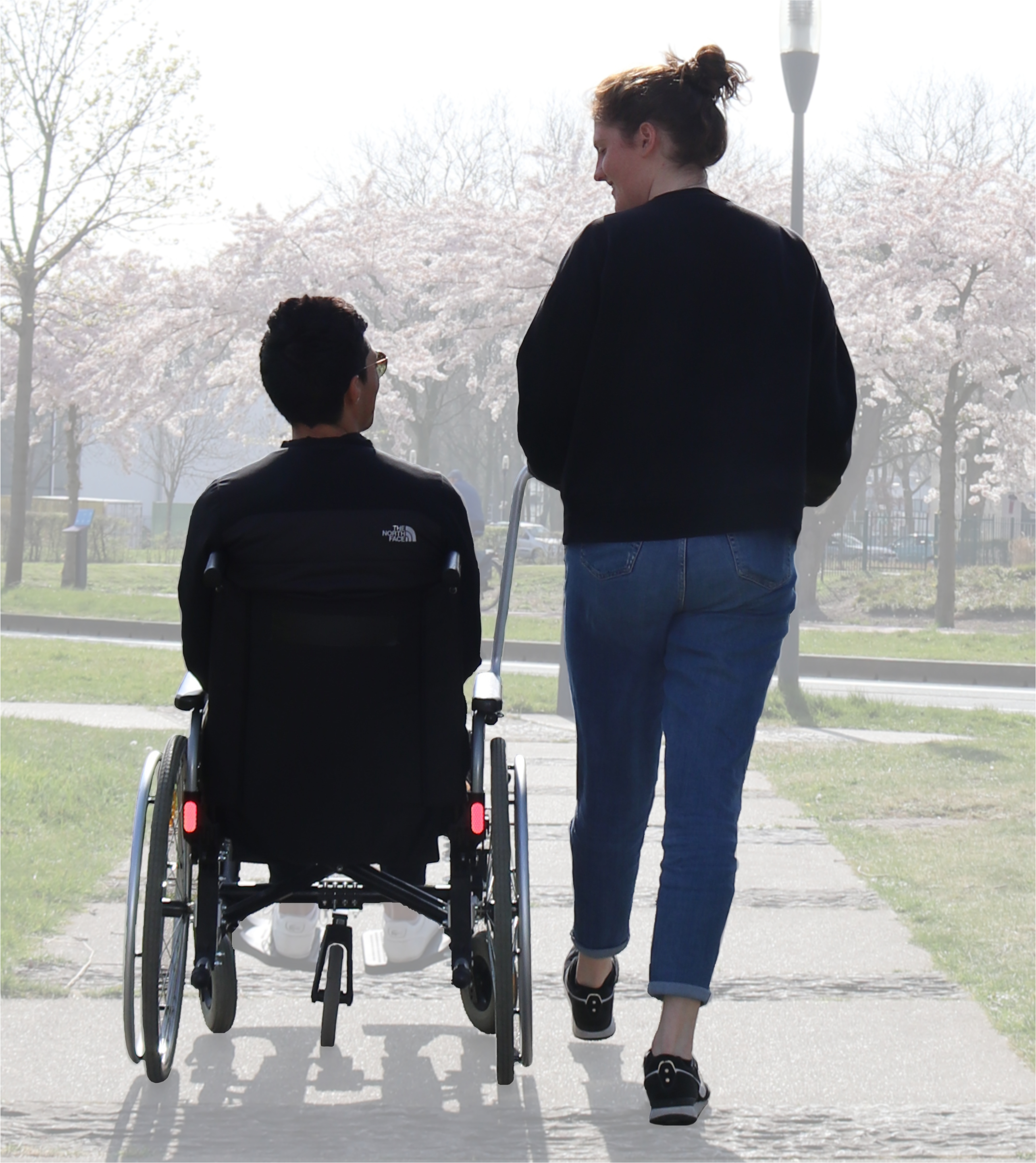 Wheelchair pushed from the side